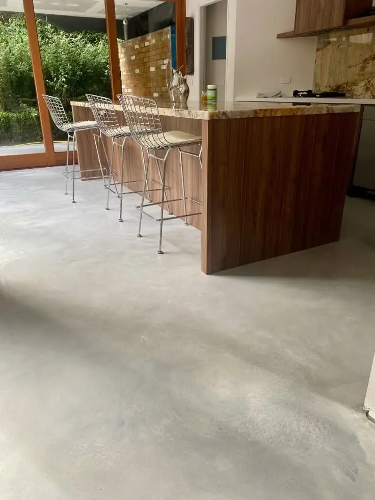 Polished concrete floor in a commercial office interior with seamless open-plan finish