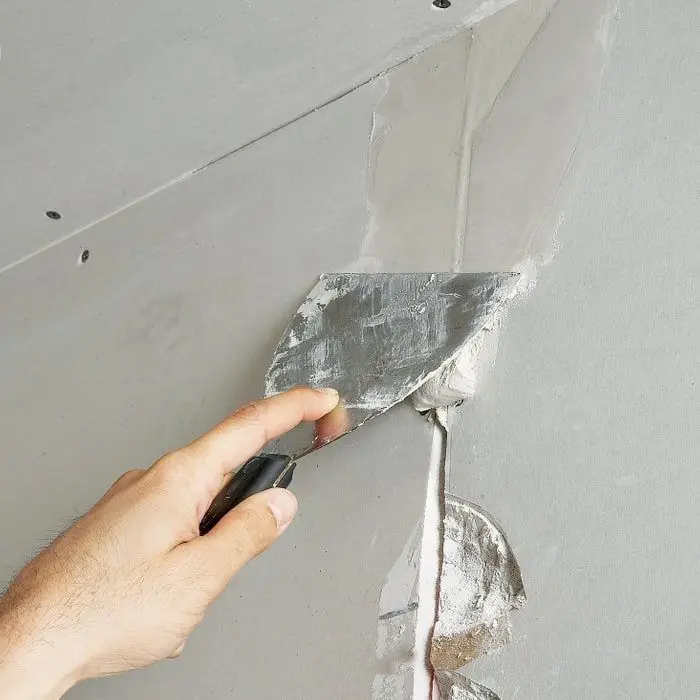 Gypsum board partition showing steel stud framing and the jointing compound finish